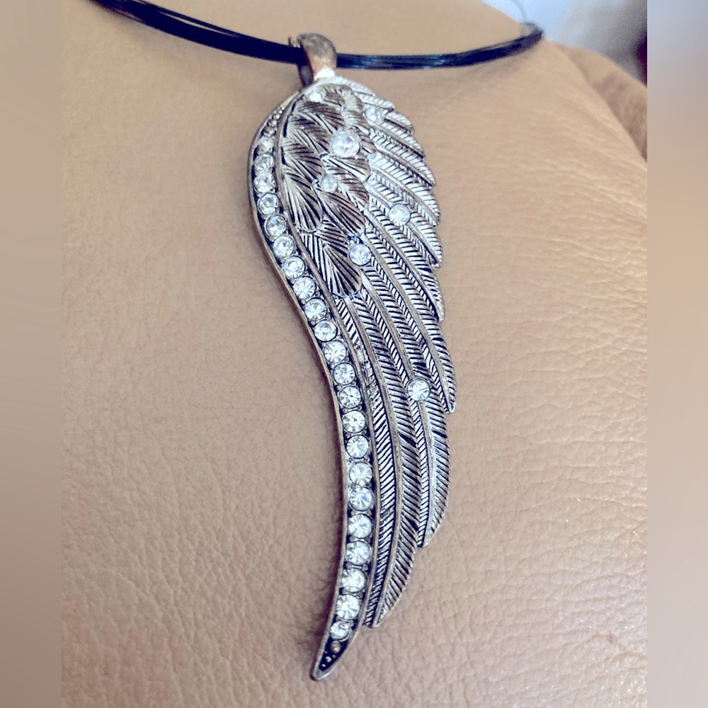 Metal wing necklace with rhinestones and detailed engraving